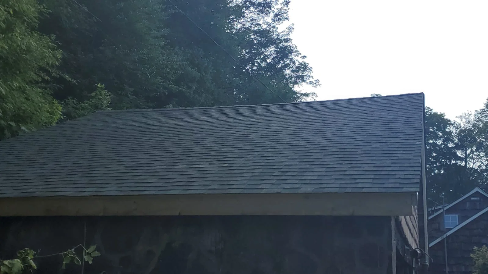 Slate gray architectural shingle roof installation on residential structure
